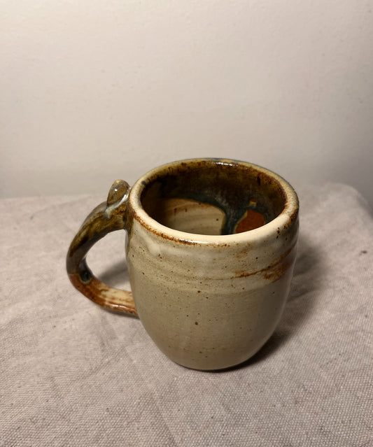 large tan & green mug