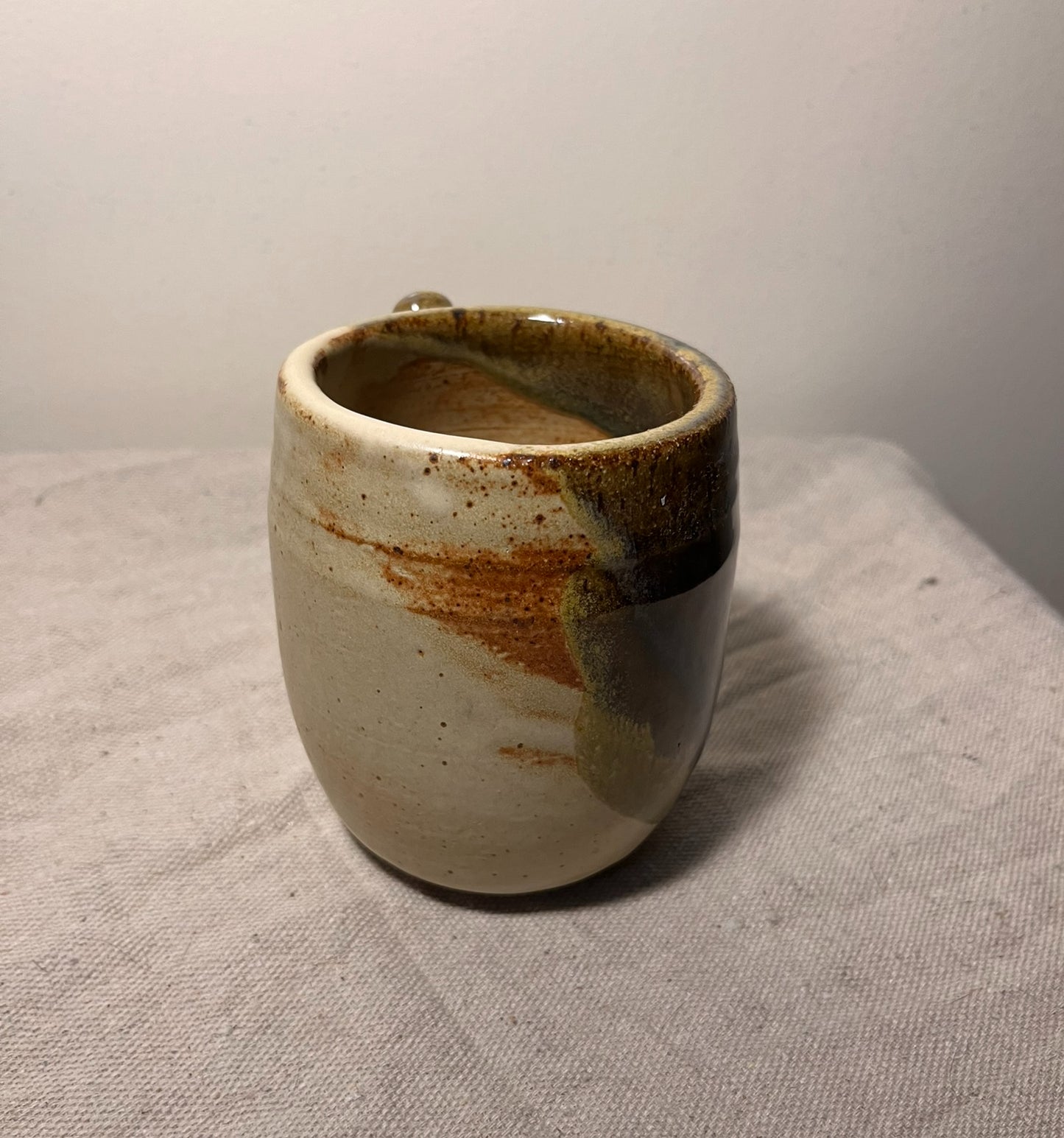 large tan & green mug