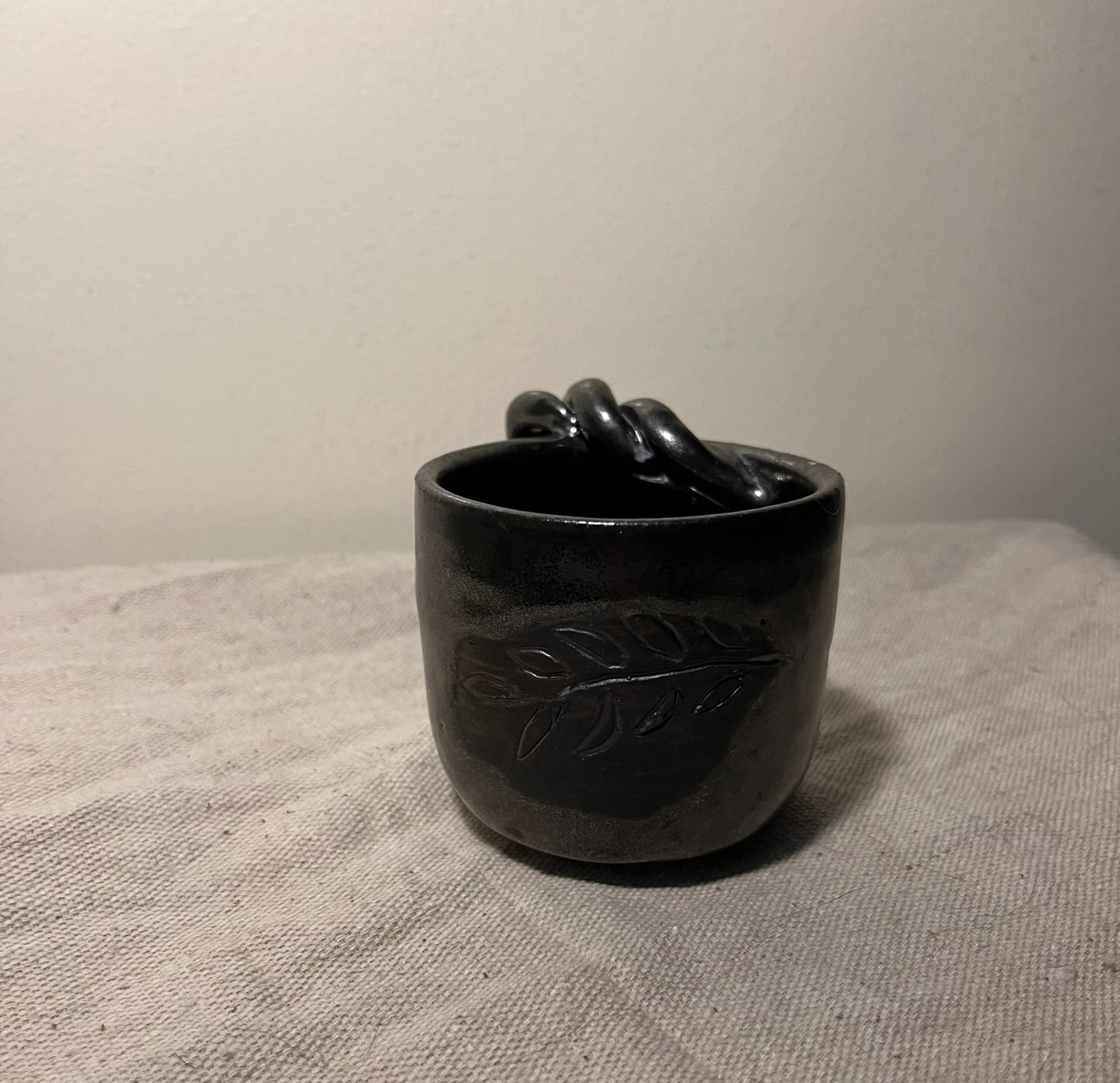 small black braided mug