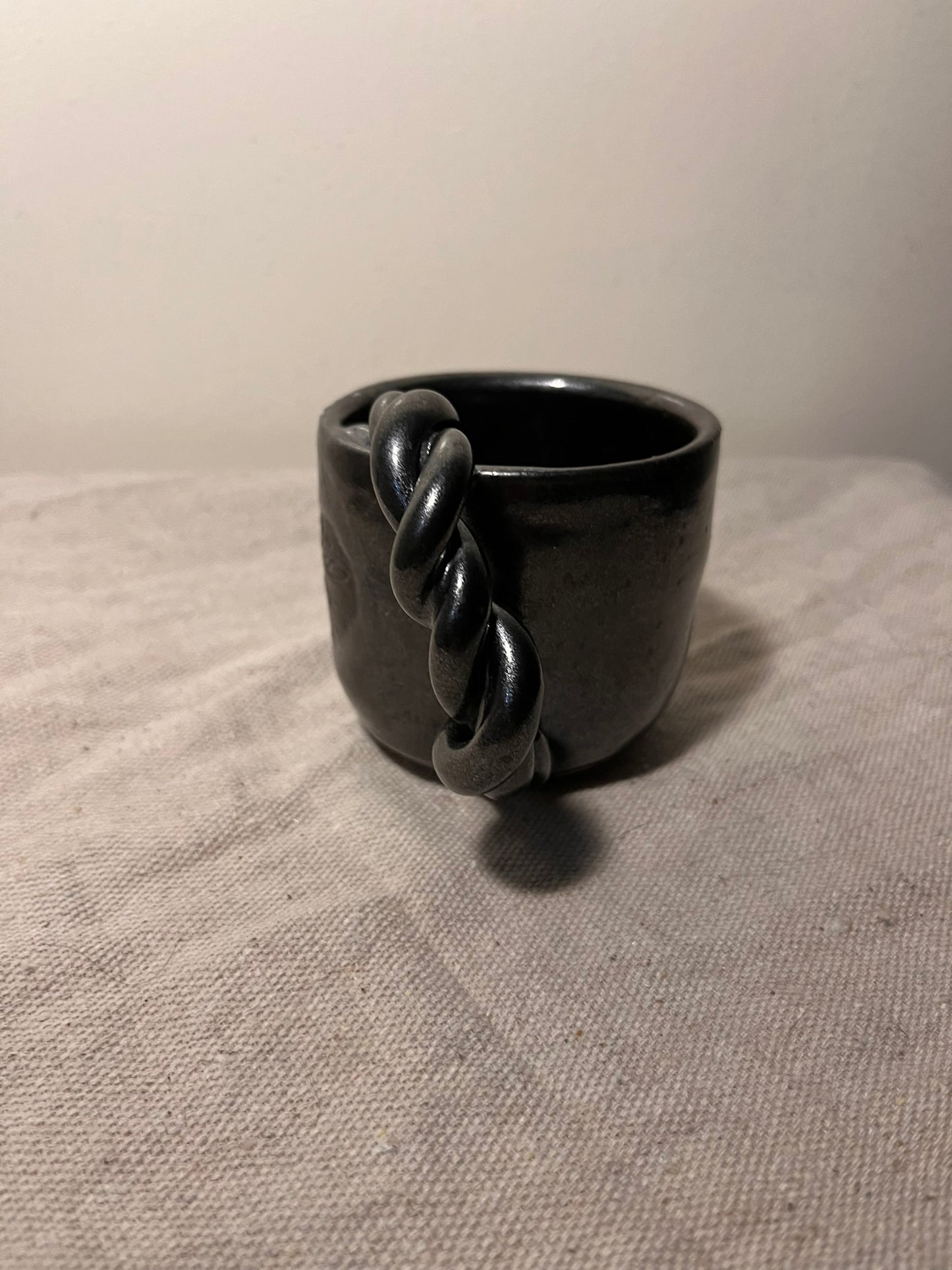 small black braided mug