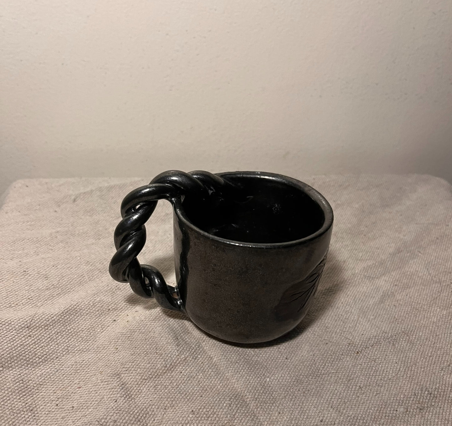 small black braided mug