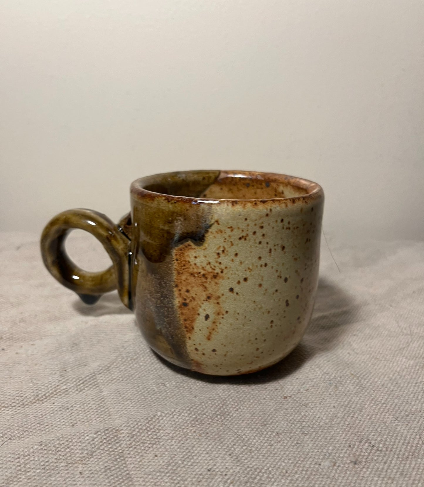 small tan & green loop handle mug